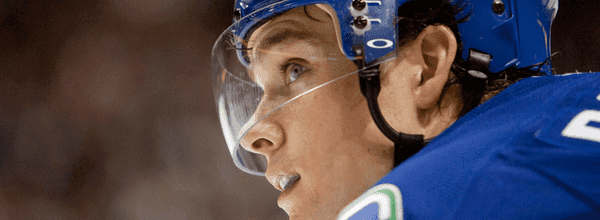 Mason Raymond gets a turn next to the Sedins