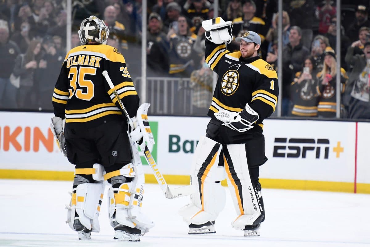 Bruins beat Devils 2-1, match NHL record with 62nd win