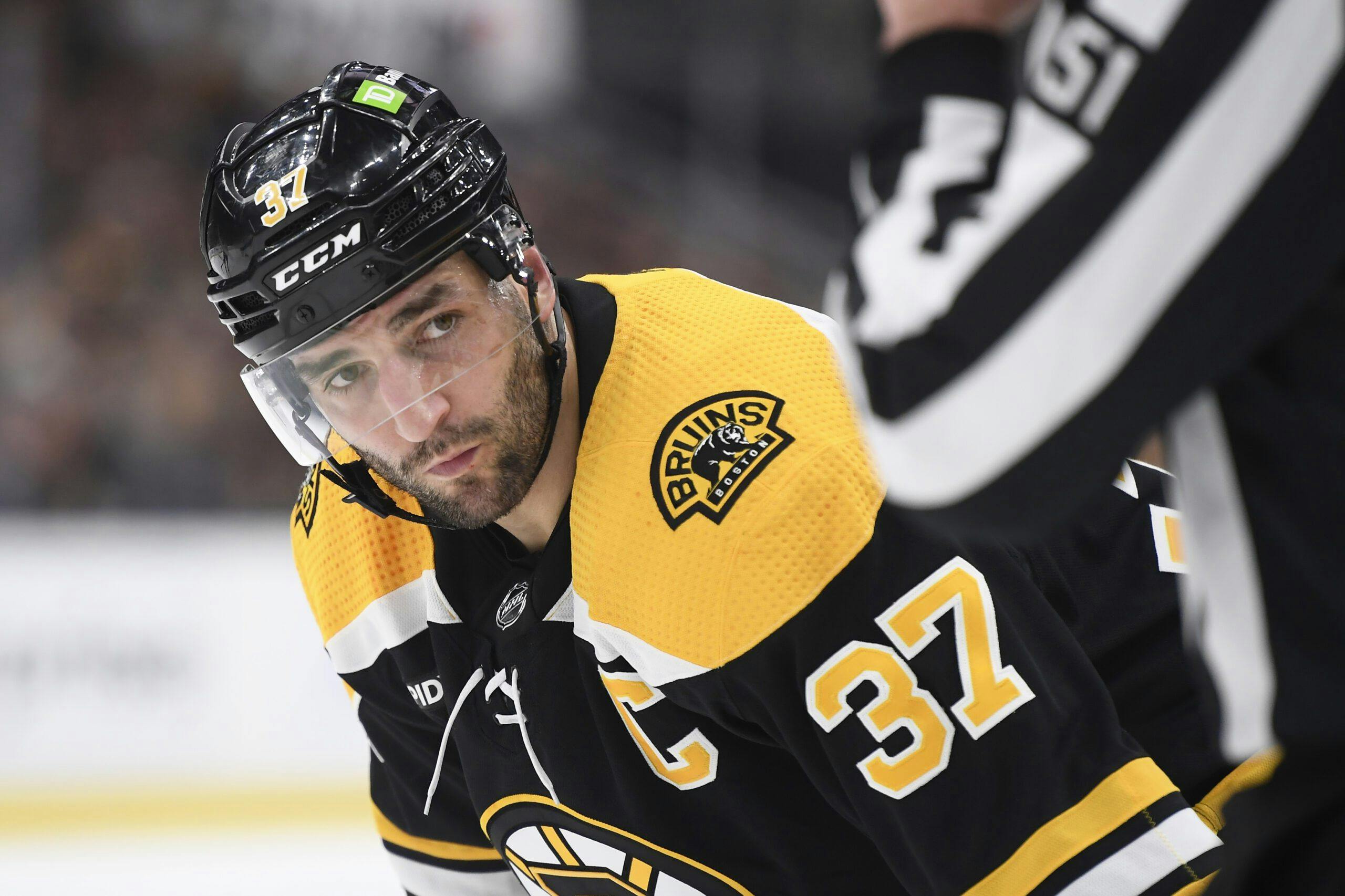 Patrice Bergeron leads off the ice, then on it