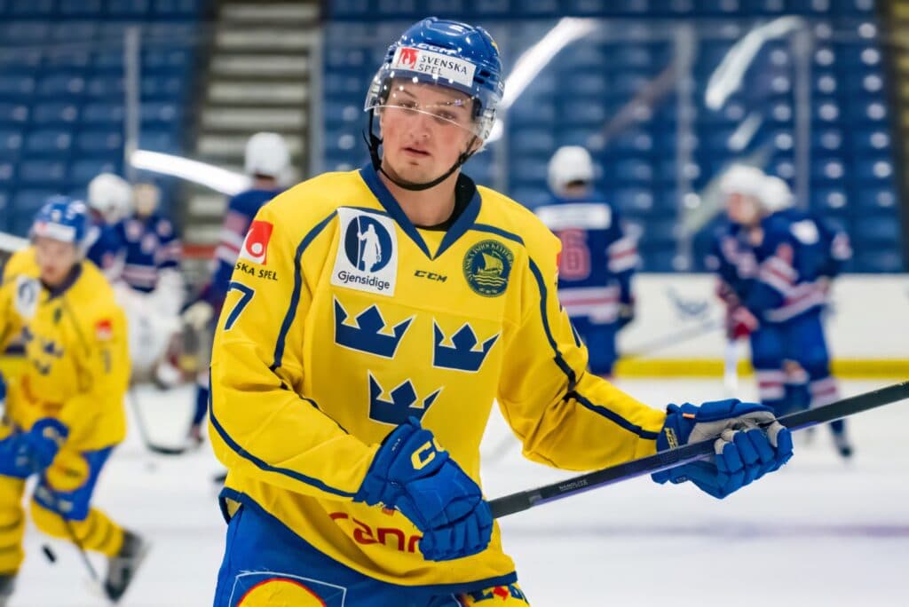 Noah Dobson New York Islanders Unsigned Blue Jersey Skating with Puck vs. Boston Bruins Photograph