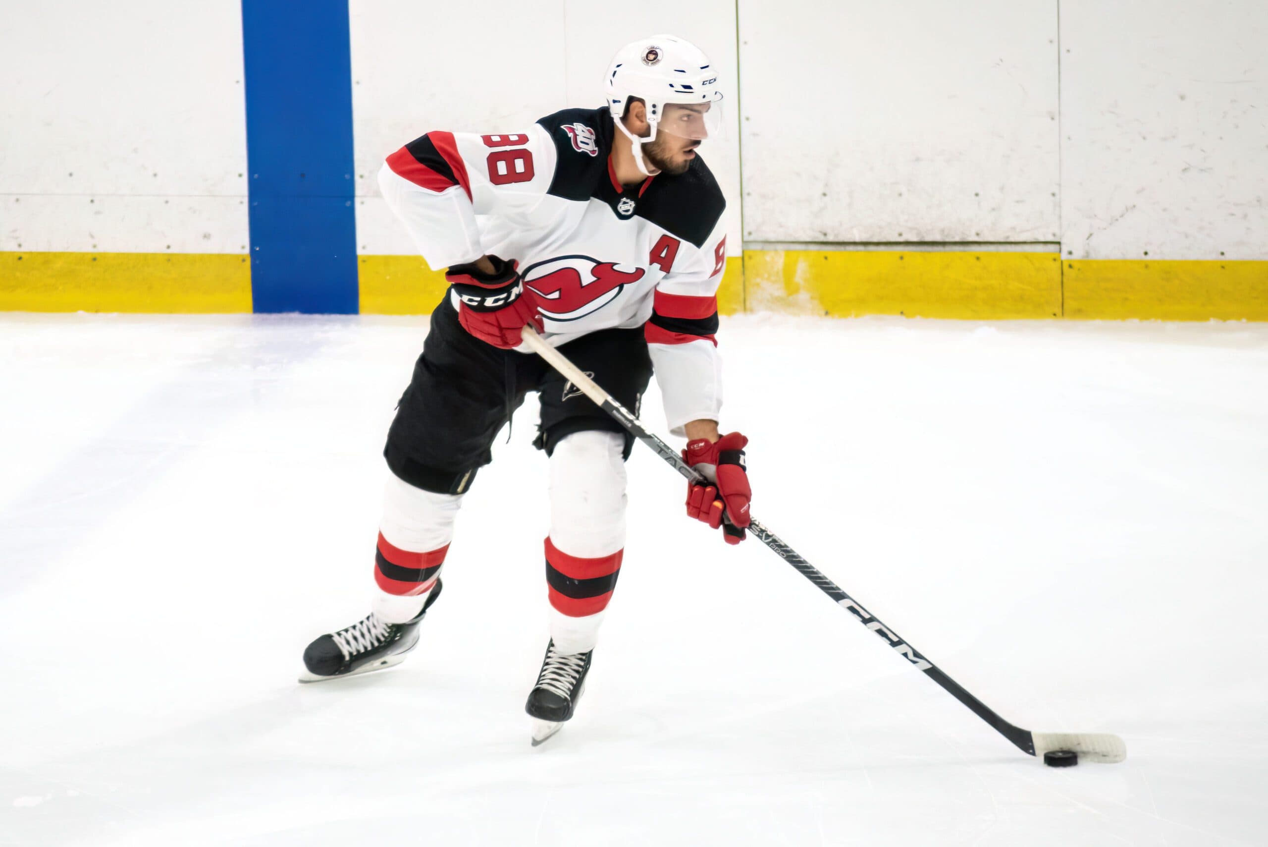 Which players who have played for both New Jersey Devils and