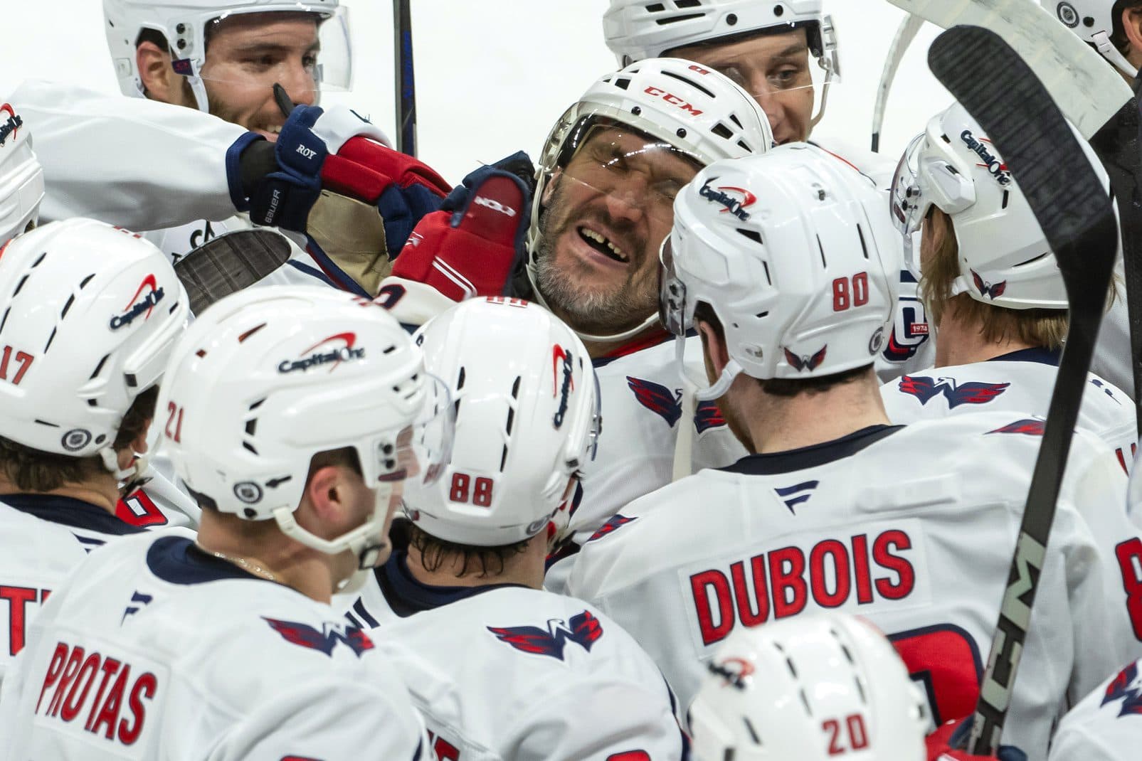 Washington Capitals left wing Alex Ovechkin (8) celebrates with team after scoring a goal in overtime against the Ottawa Senators at the Canadian Tire Centre.