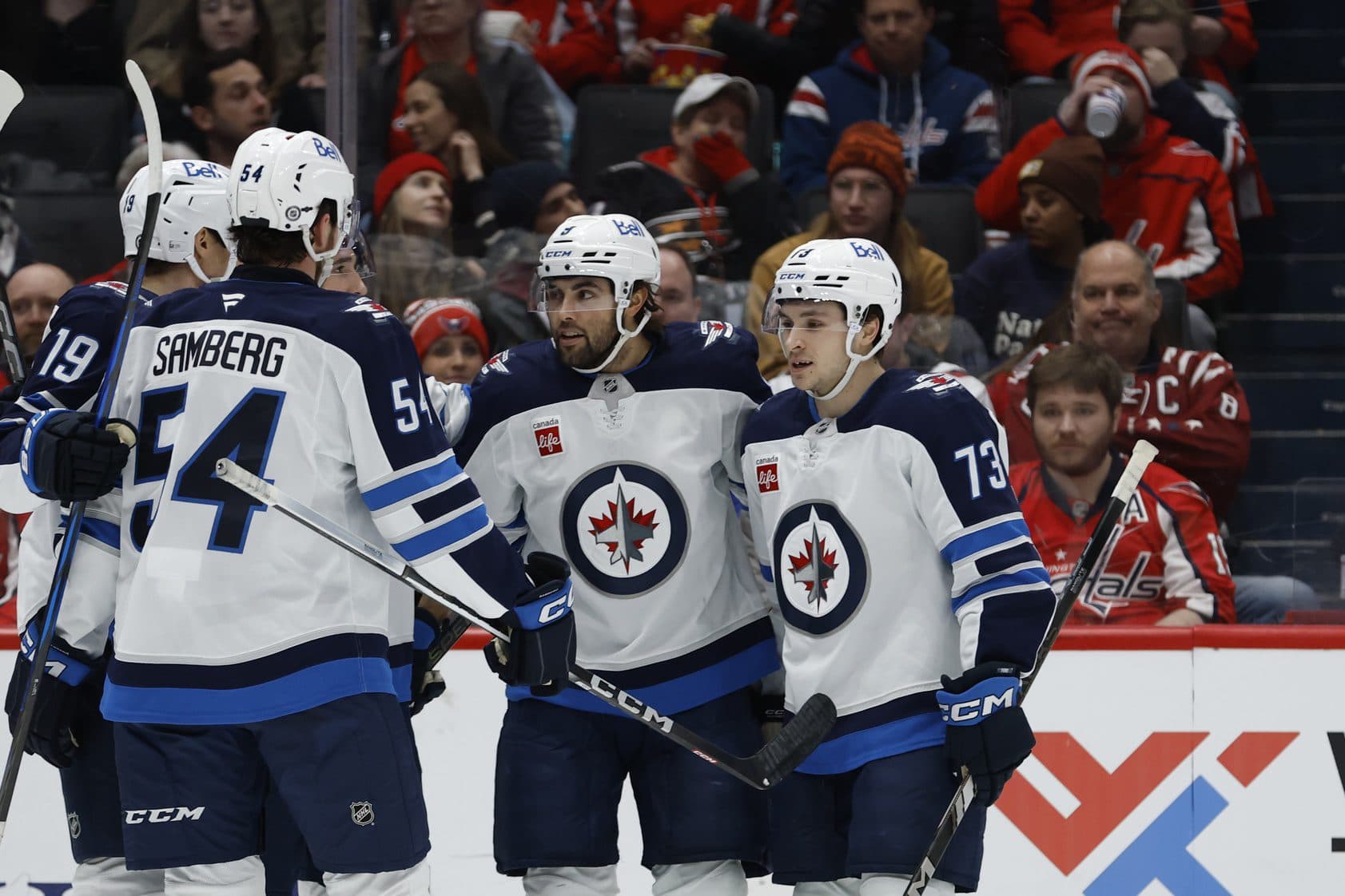 Winnipeg Jets left wing Alex Iafallo (9) celebrates with teammates after scoring a goal against the Washington Capitals in the second period at Capital One Arena