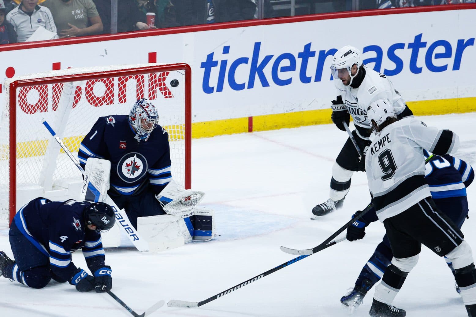 Los Angeles Kings forward Adrian Kempe (9) scores on Winnipeg Jets goalie Eric Comrie (1) during the overtime period at Canada Life Centre.