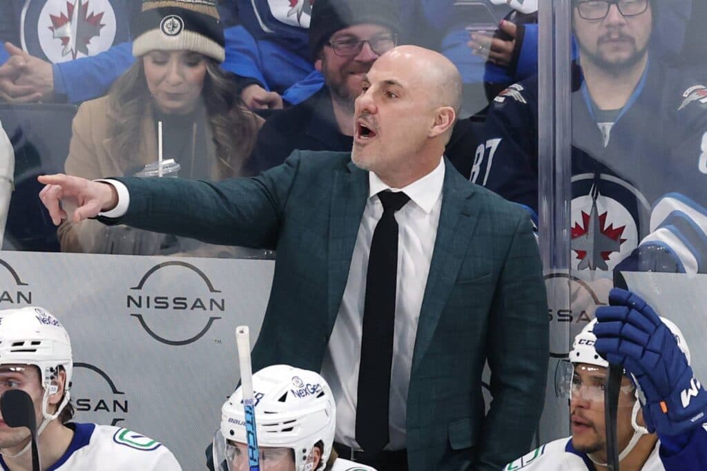 Rick Tocchet behind the bench