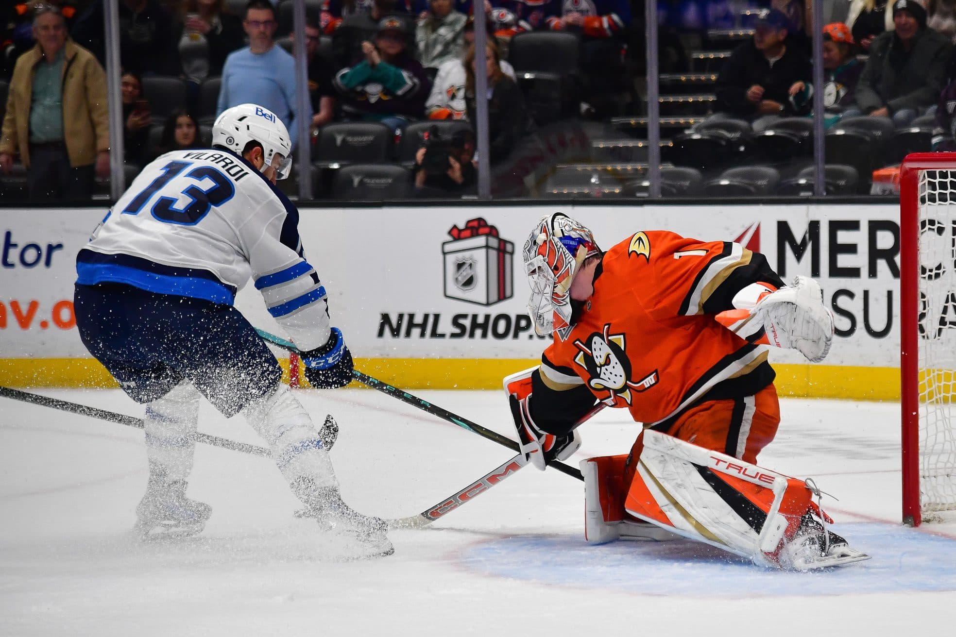 Anaheim Ducks goaltender Lukas Dostal (1) blocks a shot against Winnipeg Jets center Gabriel Vilardi (13) during the third period at Honda Center.