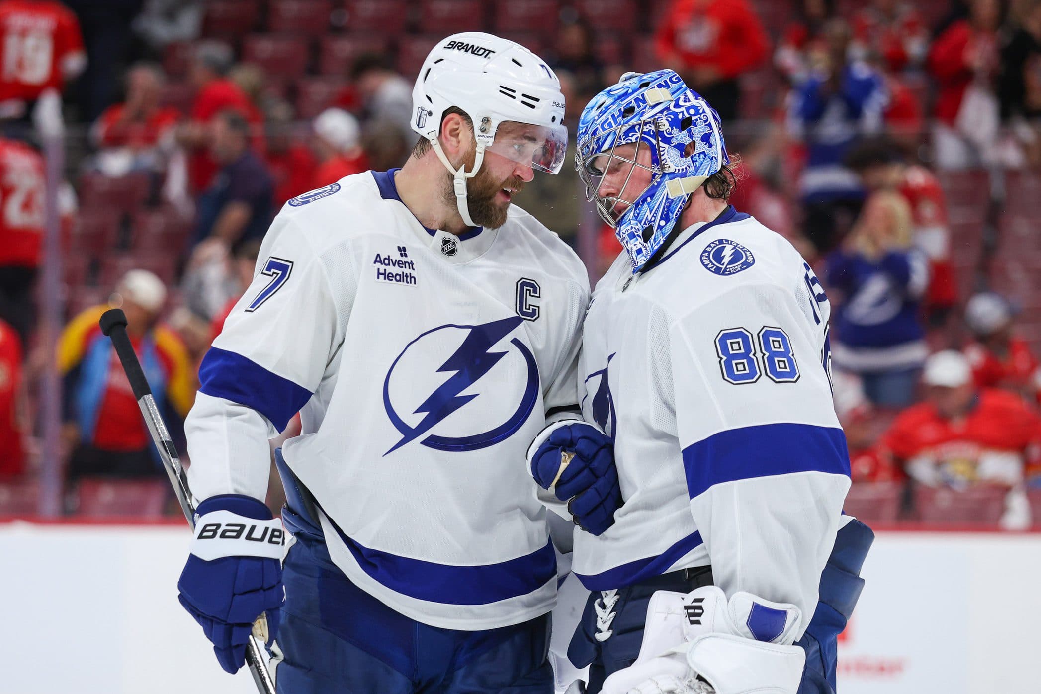 Tampa Bay Lightning defenseman Victor Hedman (77) and goaltender Andrei Vasilevskiy (88) celebrate after beating the Florida Panthers in game three of the first round of the 2025 Stanley Cup Playoffs at Amerant Bank Arena.