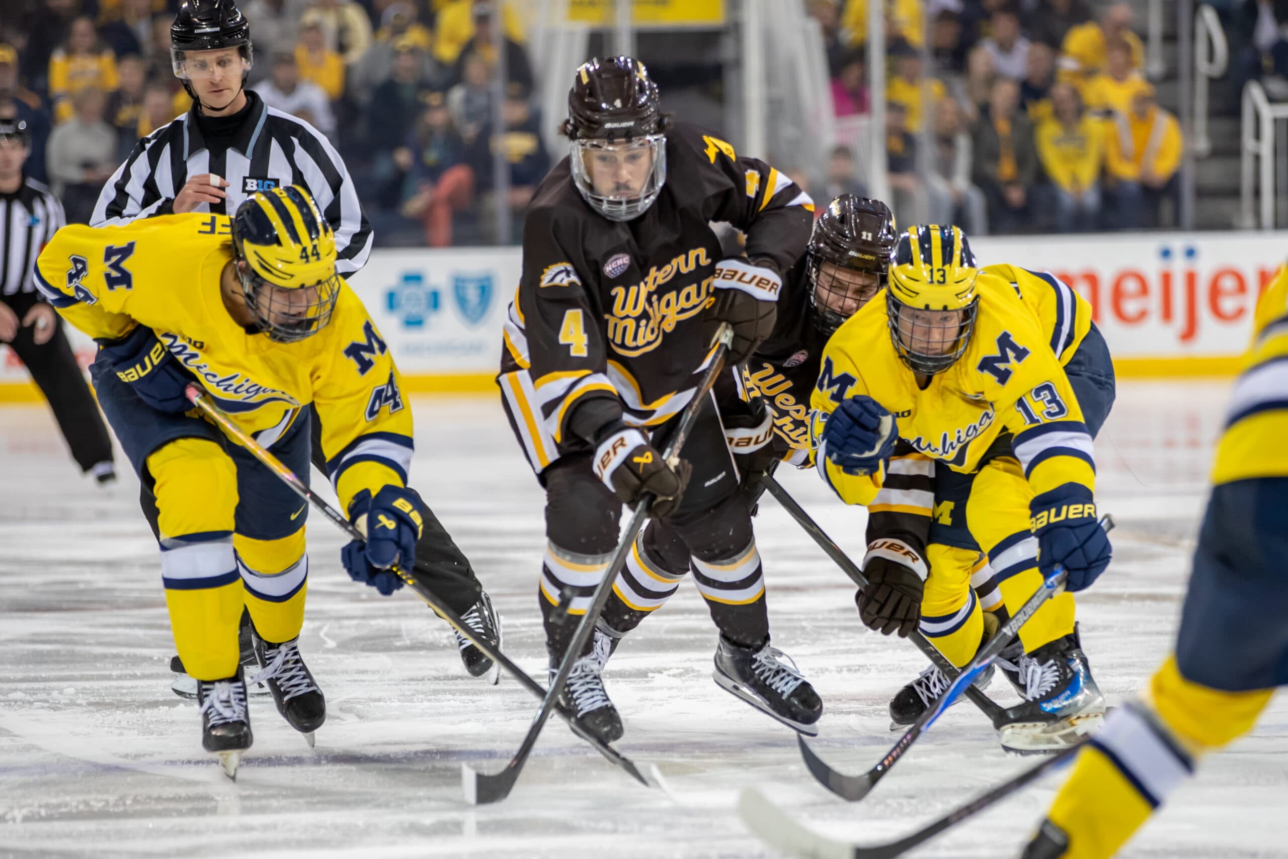 Western Michigan forward Zaccharya Wisdom, Michigan forwards TJ Hughes and Will Horcoff