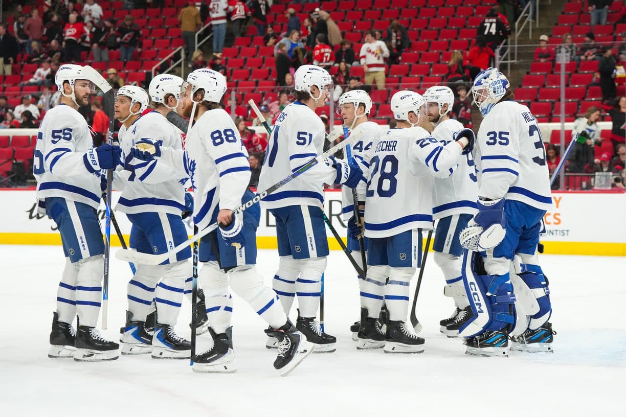 Toronto Maple Leafs players celebrate their victory against the Carolina Hurricanes at Lenovo Center.