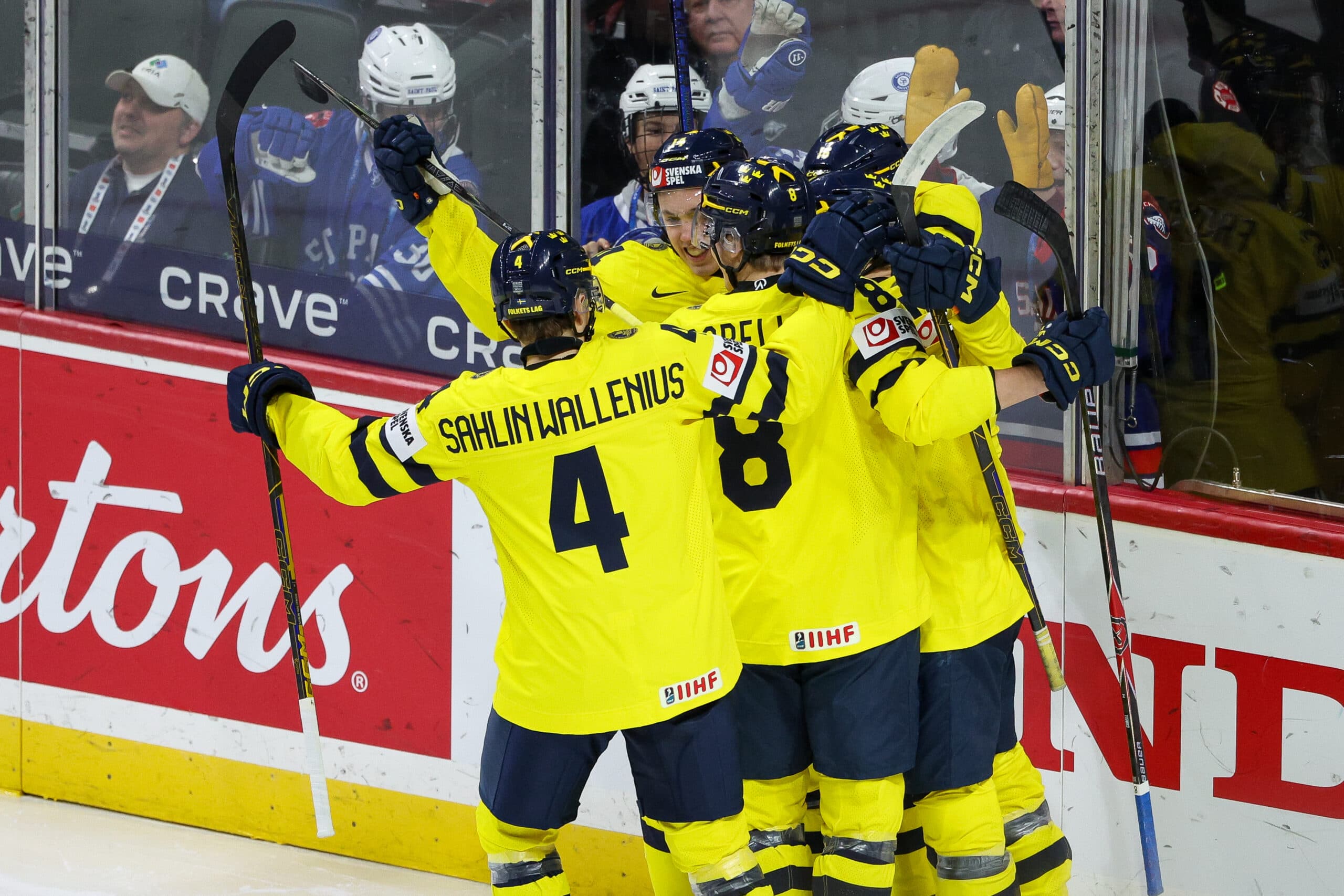 Jan 2, 2026; St. Paul, Minnesota, UNITED STATES; Sweden Forward Anton Frondell (16) celebrates his goal with teammates during the first period in the quarterfinals of the 2026 IIHF World Junior Championship against Latvia at Grand Casino Arena. Mandatory Credit: Matt Krohn-Imagn Images