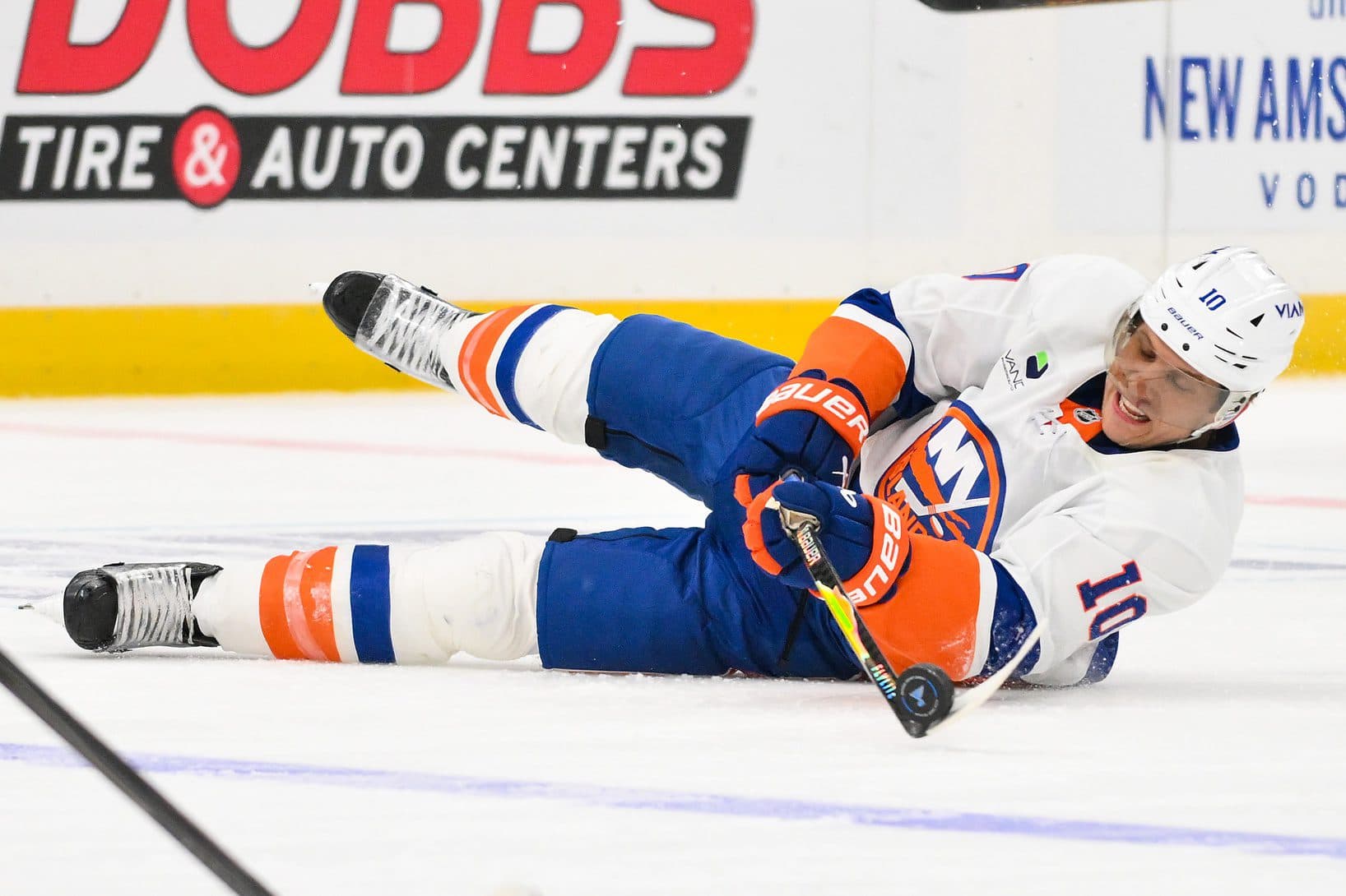 New York Islanders center Brayden Schenn (10) passes the puck as he falls to the ice during the third period against the St. Louis Blues at Enterprise Center.