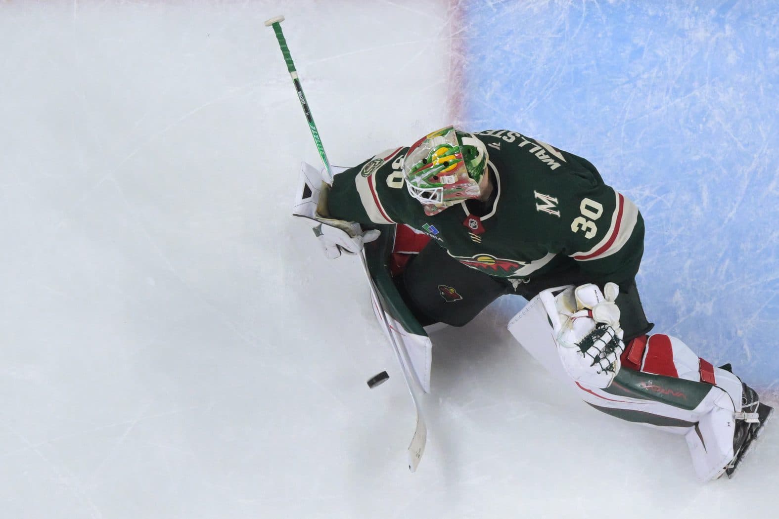 Minnesota Wild goalie Jesper Wallstedt (30) makes a save against the Dallas Stars during overtime in game four of the first round of the 2026 Stanley Cup Playoffs at Grand Casino Arena.