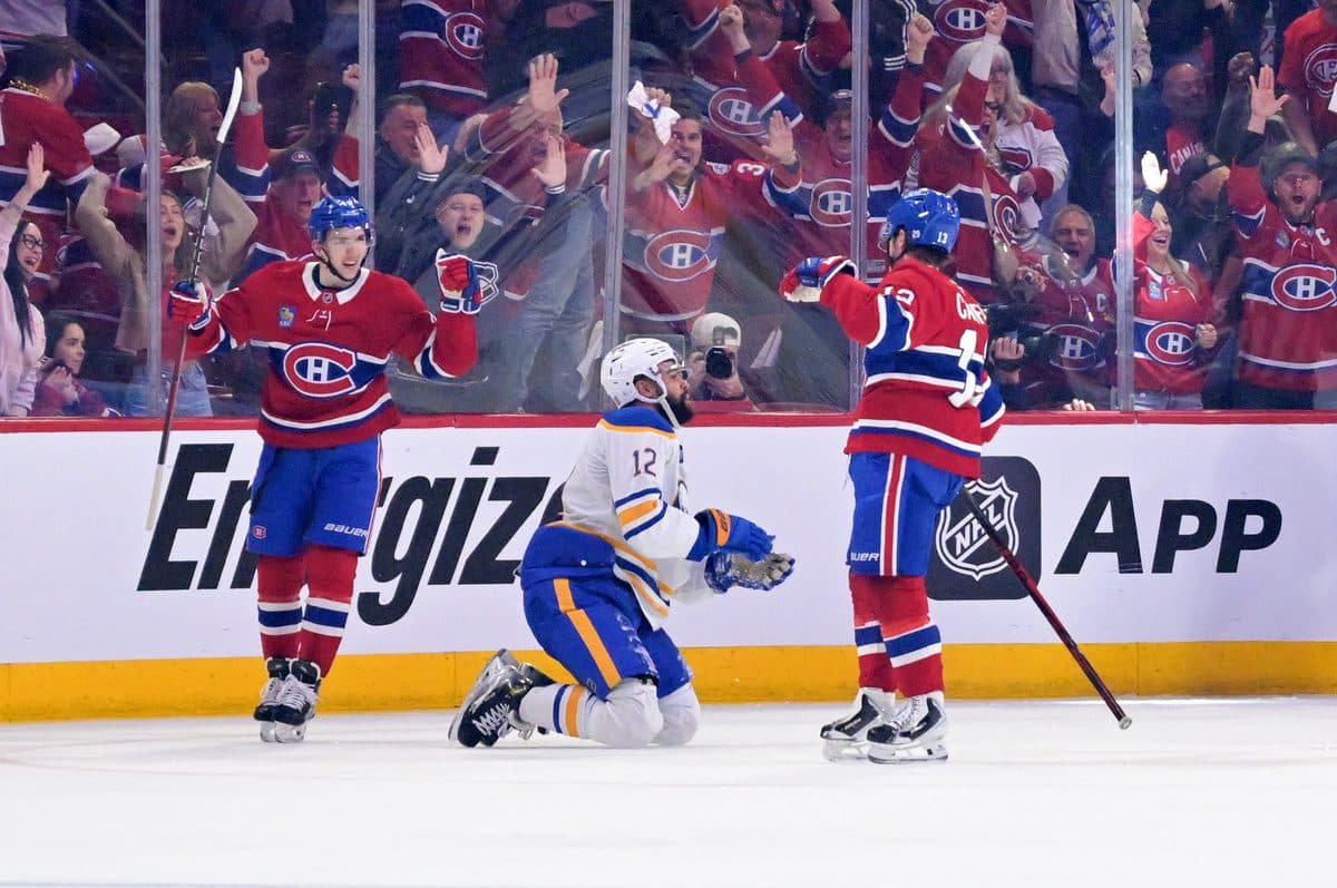 Montreal Canadiens forward Cole Caufield (13) celebrates with teammate defenseman Lane Hutson (48) after scoring a goal against the Buffalo Sabres during the second period in game three of the second round of the 2026 Stanley Cup Playoffs at the Bell Centre.