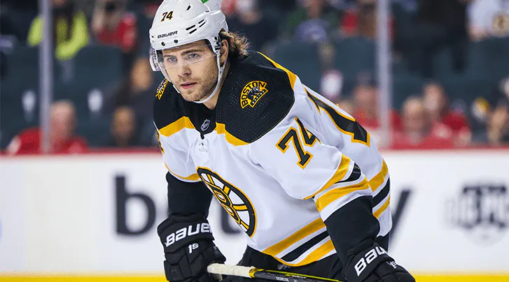 Boston Bruins’ Jake DeBrusk leaves season opener with upper-body injury