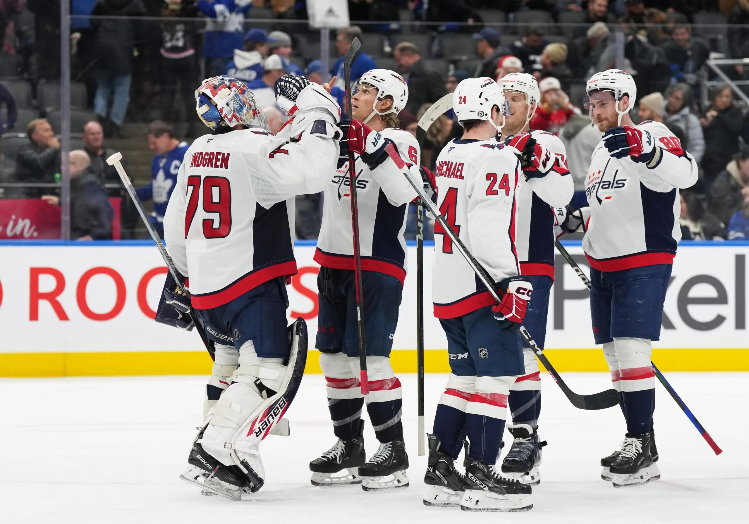 Washington Capitals defenseman Jakob Chychrun (6) celebrates the win with goaltender Charlie Lindgren (79) against the Toronto Maple Leafs at the end of the third period at Scotiabank Arena.