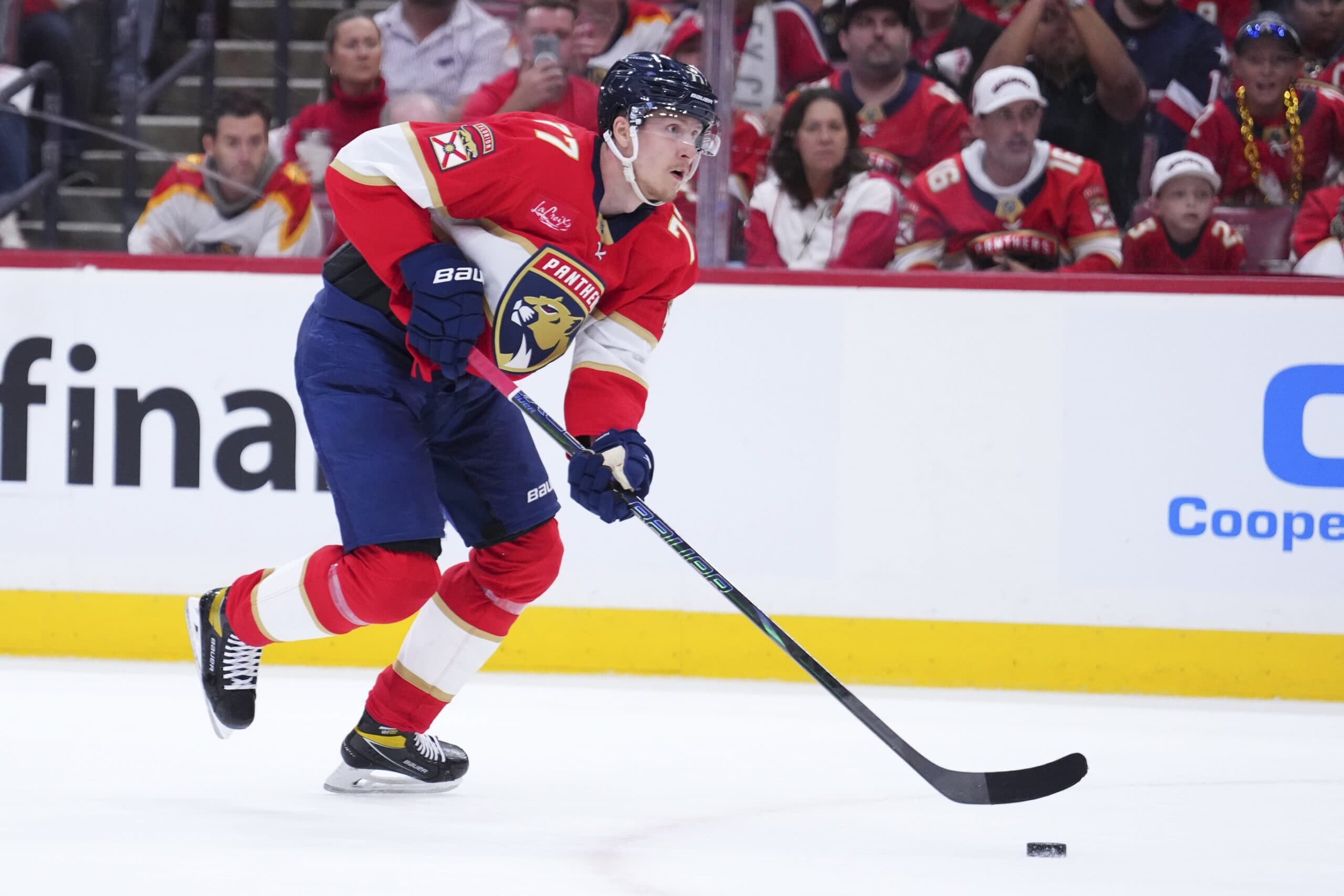 Florida Panthers defenseman Niko Mikkola (77) controls the puck against the Tampa Bay Lightning during the first period in game four of the first round of the 2025 Stanley Cup Playoffs at Amerant Bank Arena.