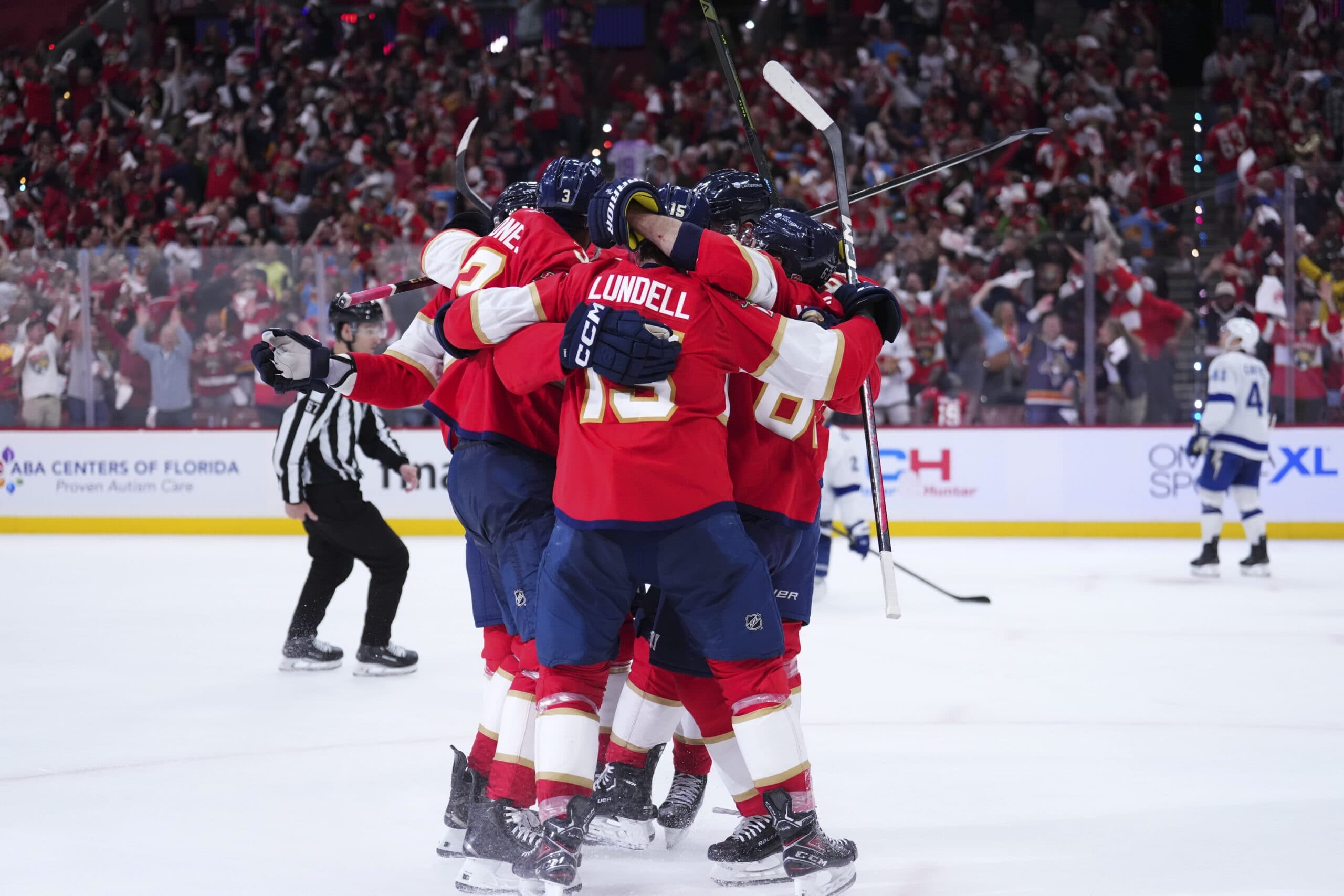 Florida Panthers defenseman Seth Jones (3) celebrates with teammates after scoring against the Tampa Bay Lightning during the third periodin game four of the first round of the 2025 Stanley Cup Playoffs at Amerant Bank Arena.