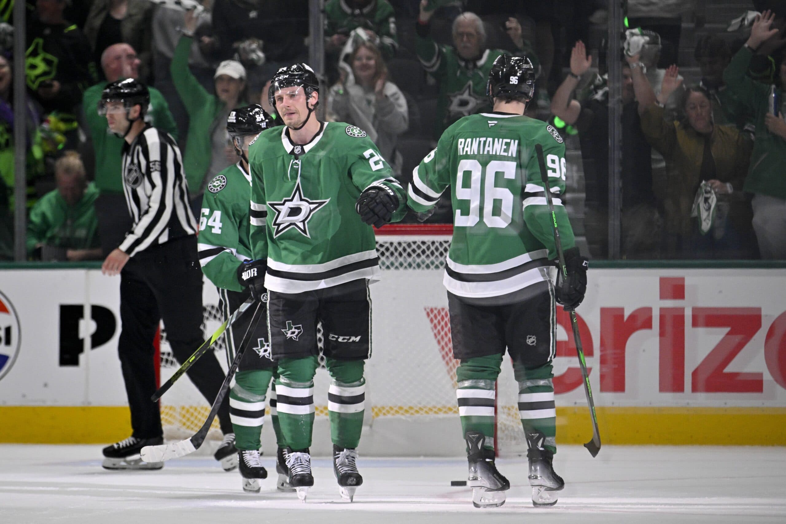 Dallas Stars center Roope Hintz (24) and right wing Mikko Rantanen (96) celebrates an empty net goal scored by Hintz against the Colorado Avalanche during the third period in game five of the first round of the 2025 Stanley Cup Playoffs at American Airlines Center.