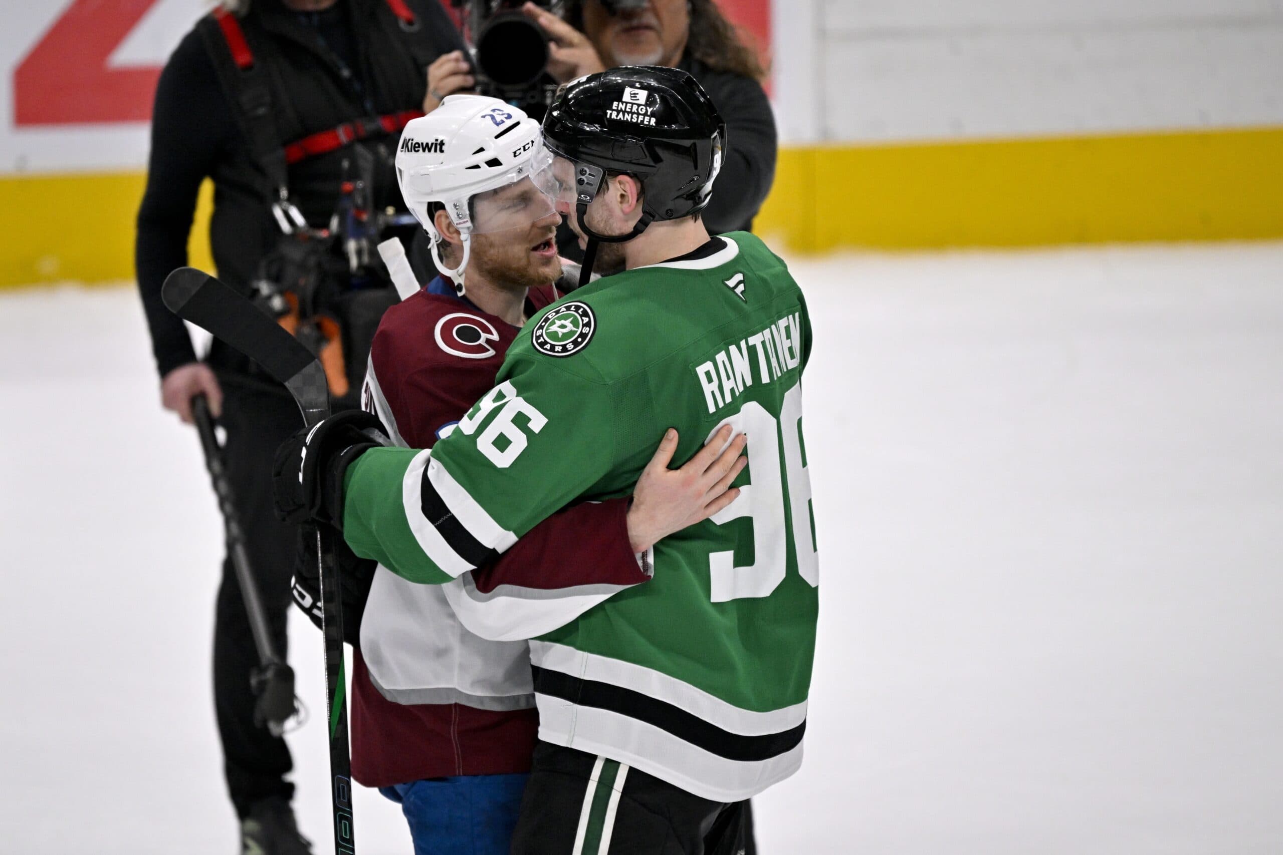 Colorado Avalanche center Nathan MacKinnon (29) hugs Dallas Stars right wing Mikko Rantanen (96) after the Stars defeats the Avalanche in game seven of the first round of the 2025 Stanley Cup Playoffs at American Airlines Center.