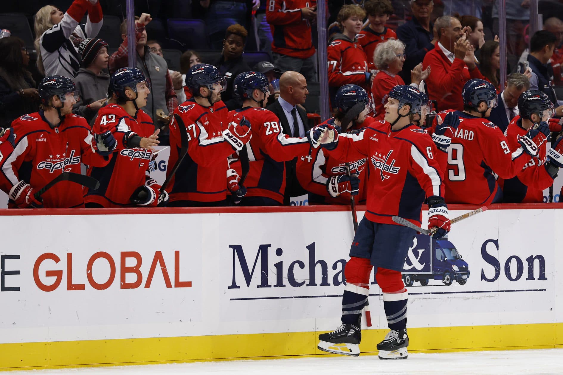 Washington Capitals defenseman Jakob Chychrun (6) celebrates with teammates after scoring a goal against the Seattle Kraken during the second period at Capital One Arena.