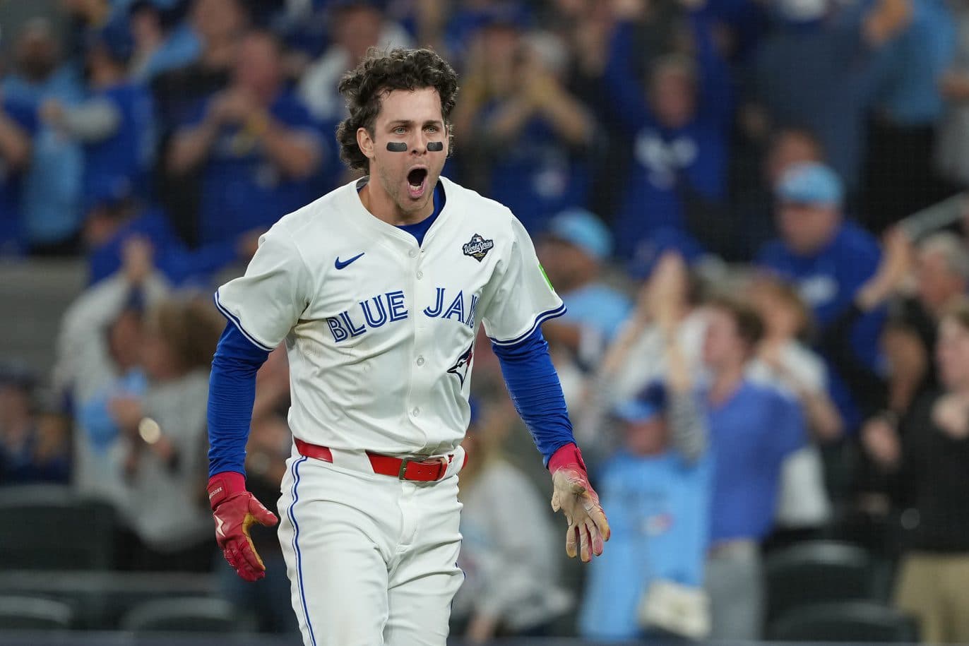 Toronto Blue Jays third baseman Ernie Clement (22) reacts after scoring a run against the Los Angeles Dodgers in the sixth inning for game seven of the 2025 MLB World Series at Rogers Centre.