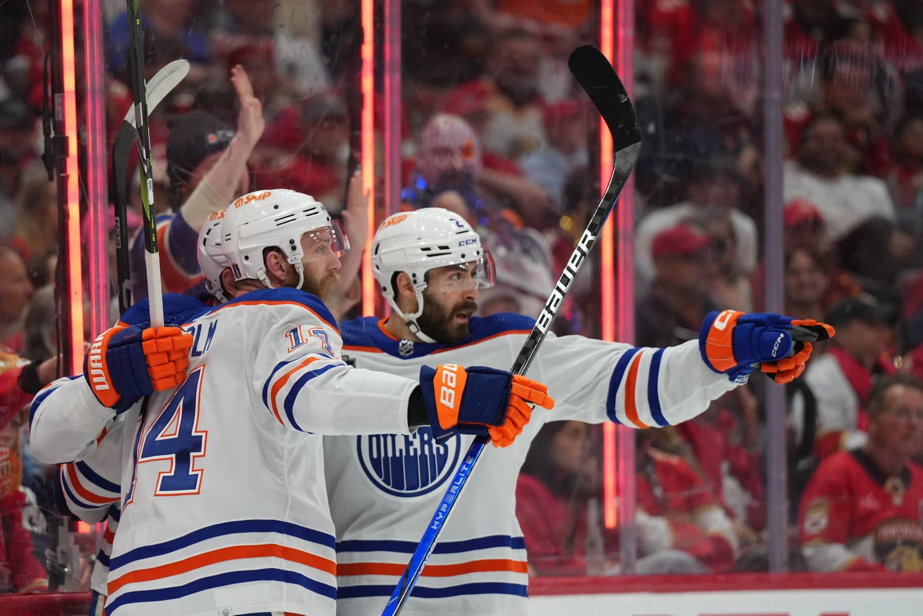 Edmonton Oilers defenseman Mattias Ekholm (14) celebrates scoring with defenseman Evan Bouchard (2) against the Florida Panthers during the first period in game two of the 2024 Stanley Cup Final at Amerant Bank Arena.