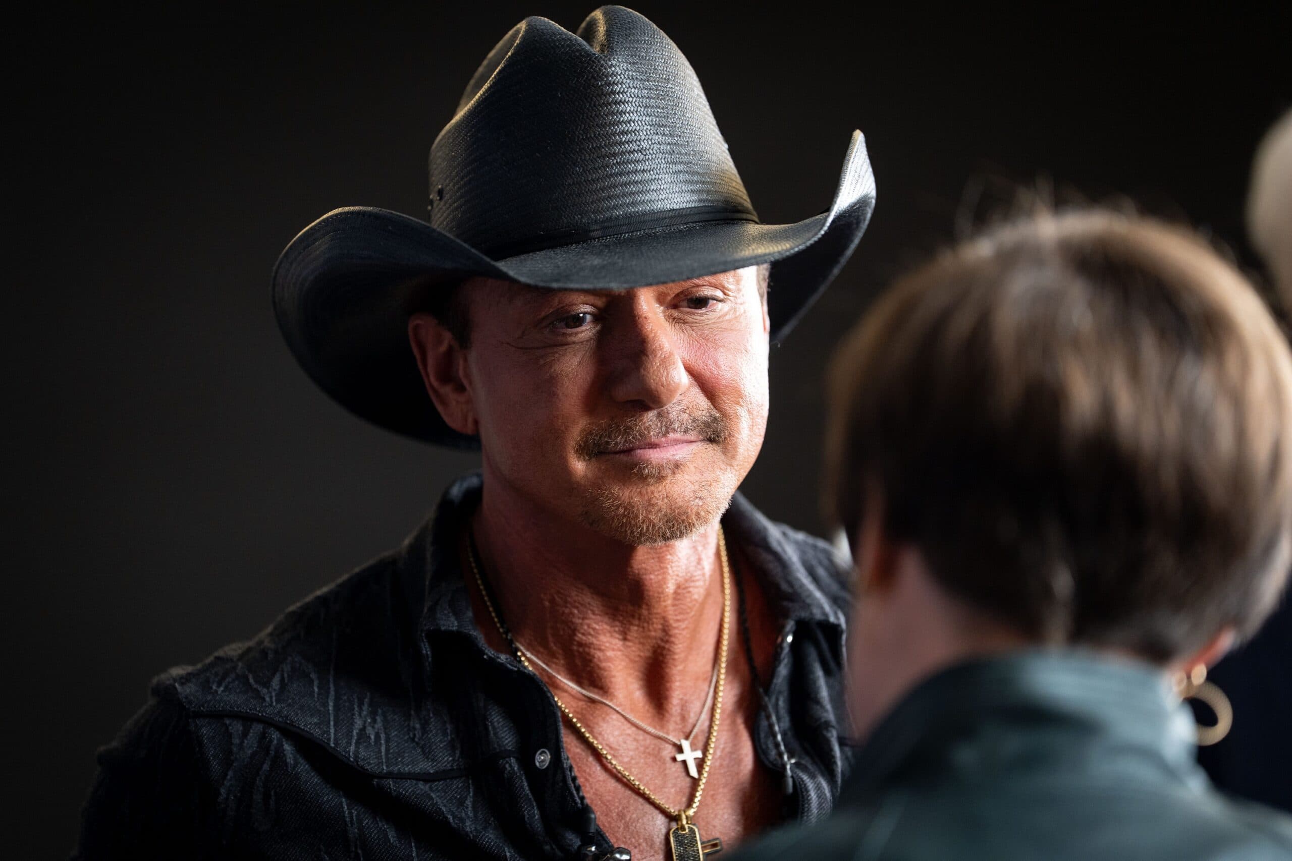 Tim McGraw talks with a fan during a meet and greet on the final night of the Music City Rodeo at Bridgestone Arena in Nashville, Tenn., Saturday, May 31, 2025