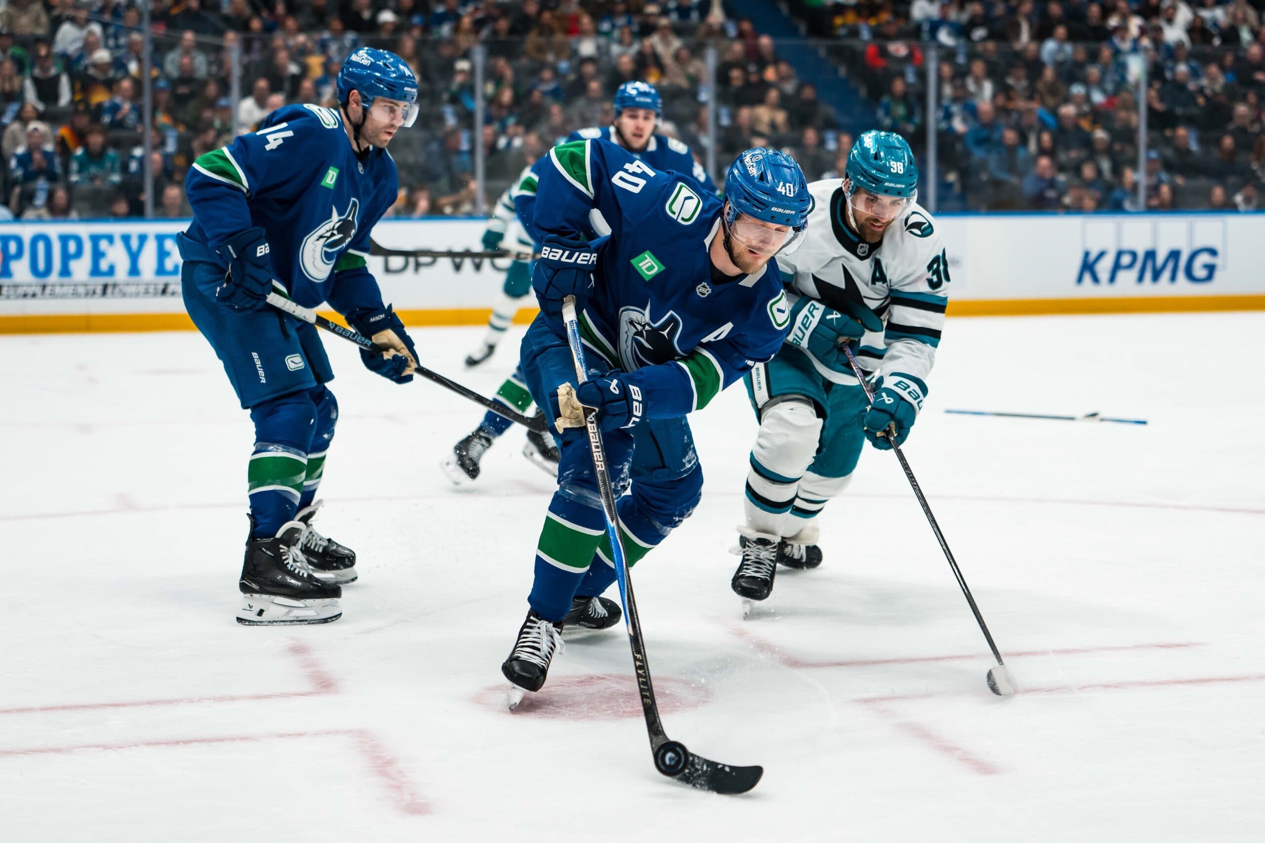 San Jose Sharks defenseman Mario Ferraro (38) defends against Vancouver Canucks forward Elias Pettersson (40) in the first period at Rogers Arena.