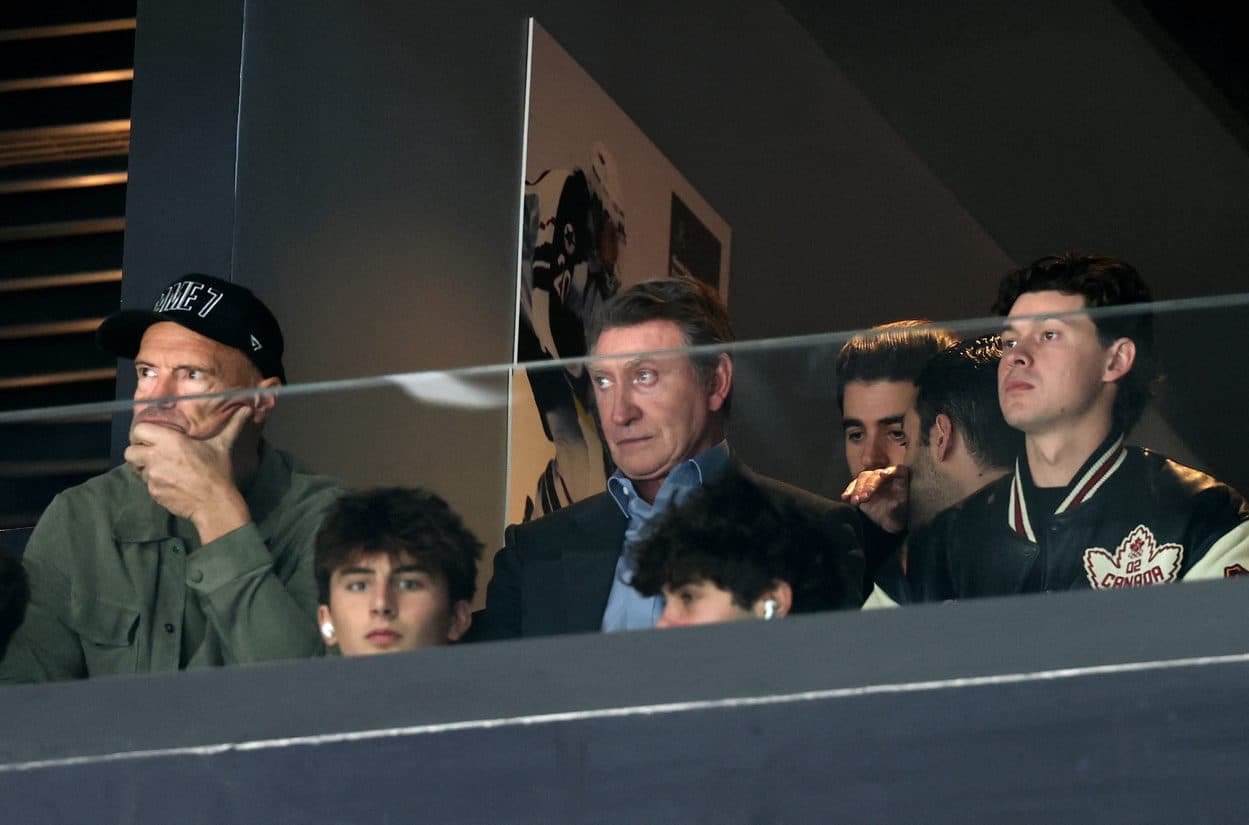 Former ice hockey players Wayne Gretzky and Mark Messier watch the match between Canada and Finland in a men's ice hockey semifinal during the Milano Cortina 2026 Olympic Winter Games at Milano Santagiulia Ice Hockey Arena.