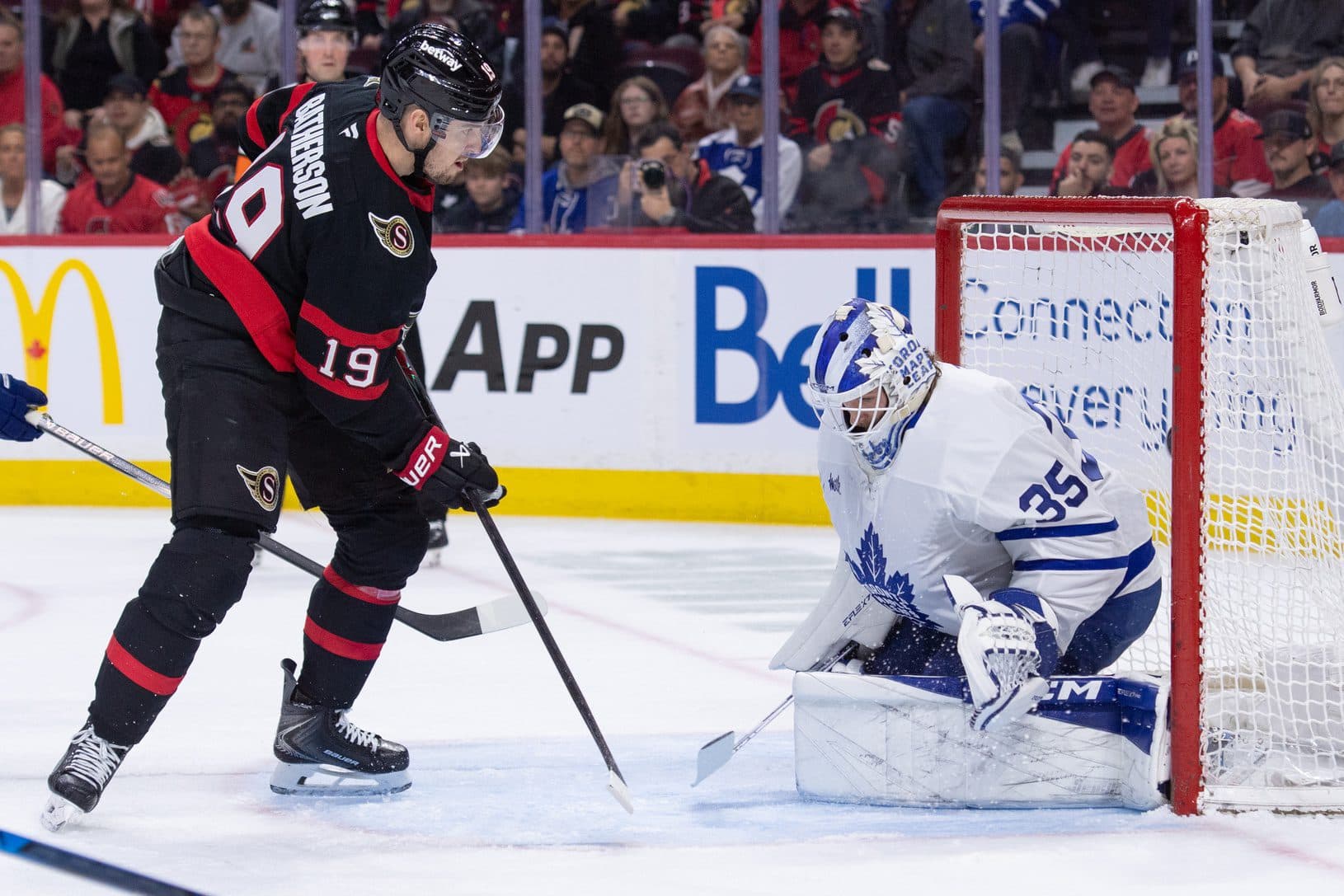 Ottawa Senators right wing Drake Batherson (19) scores against Toronto Maple Leafs goalie Dennis Hildeby (35) in the first period at the Canadian Tire Centre.