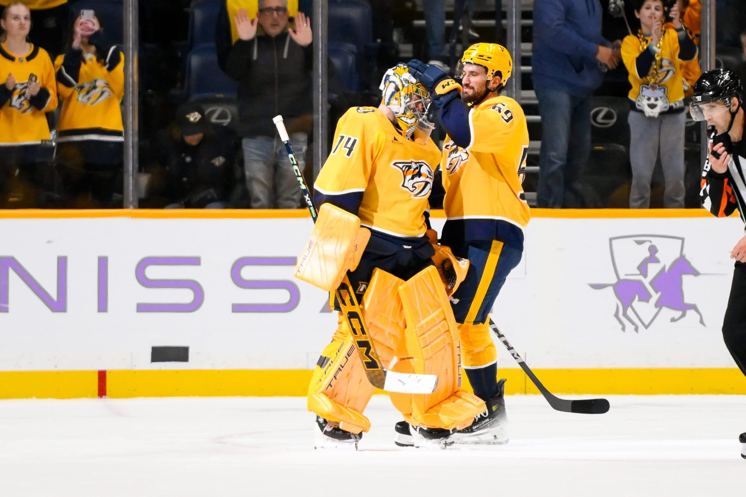 Nashville Predators defenseman Roman Josi (59) congratulates goaltender Juuse Saros (74) on the win against the Utah Hockey Club during the third period at Bridgestone Arena.