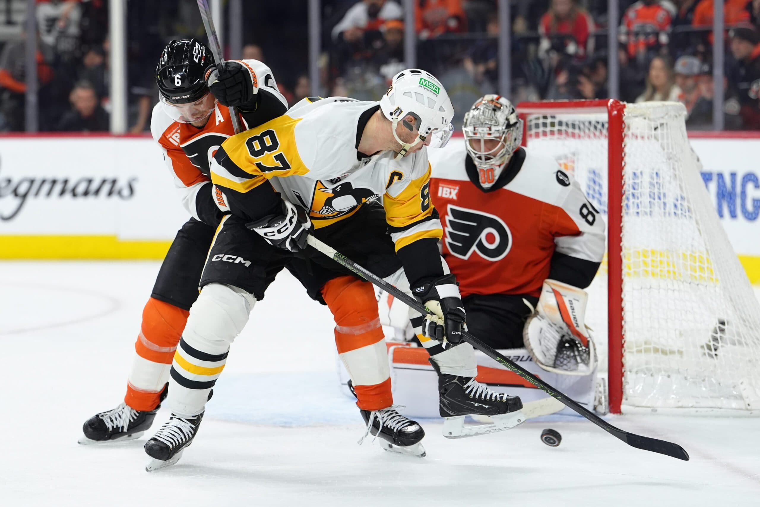 Travis Sanheim, Sidney Crosby and Dan Vladar