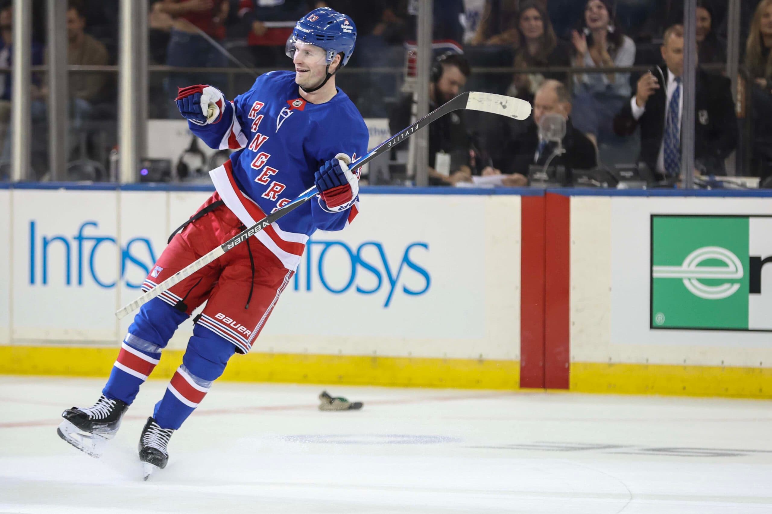 New York Rangers left wing Alexis Lafreniere (13) celebrates after scoring a third goal for a hat trick in the third period against the New York Islanders at Madison Square Garden.