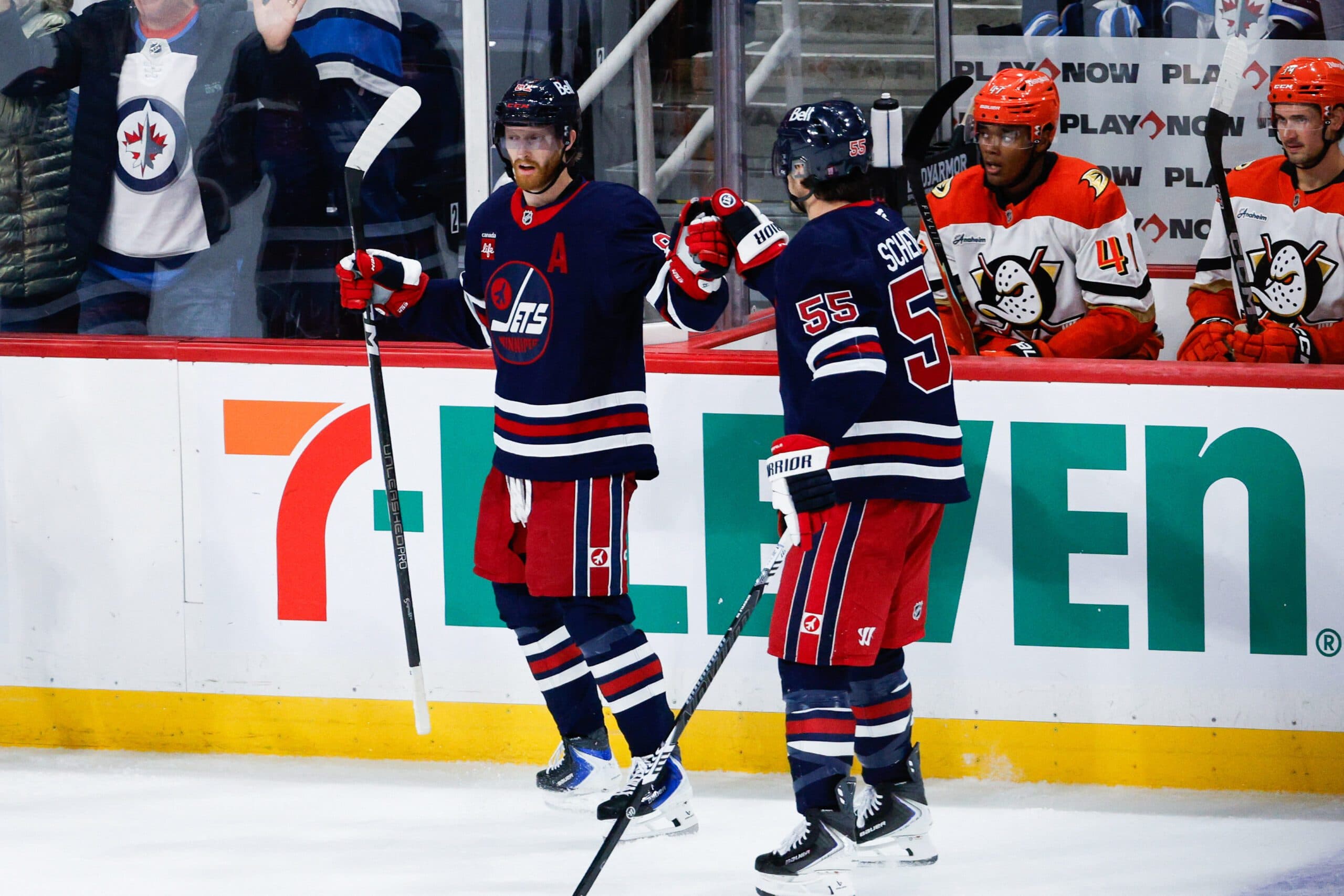 Winnipeg Jets forward Kyle Connor (81) is congratulated by Winnipeg Jets forward Mark Scheifele (55) on his goal on Anaheim Ducks goalie Lukas Dostal (1) during the third period at Canada Life Centre.