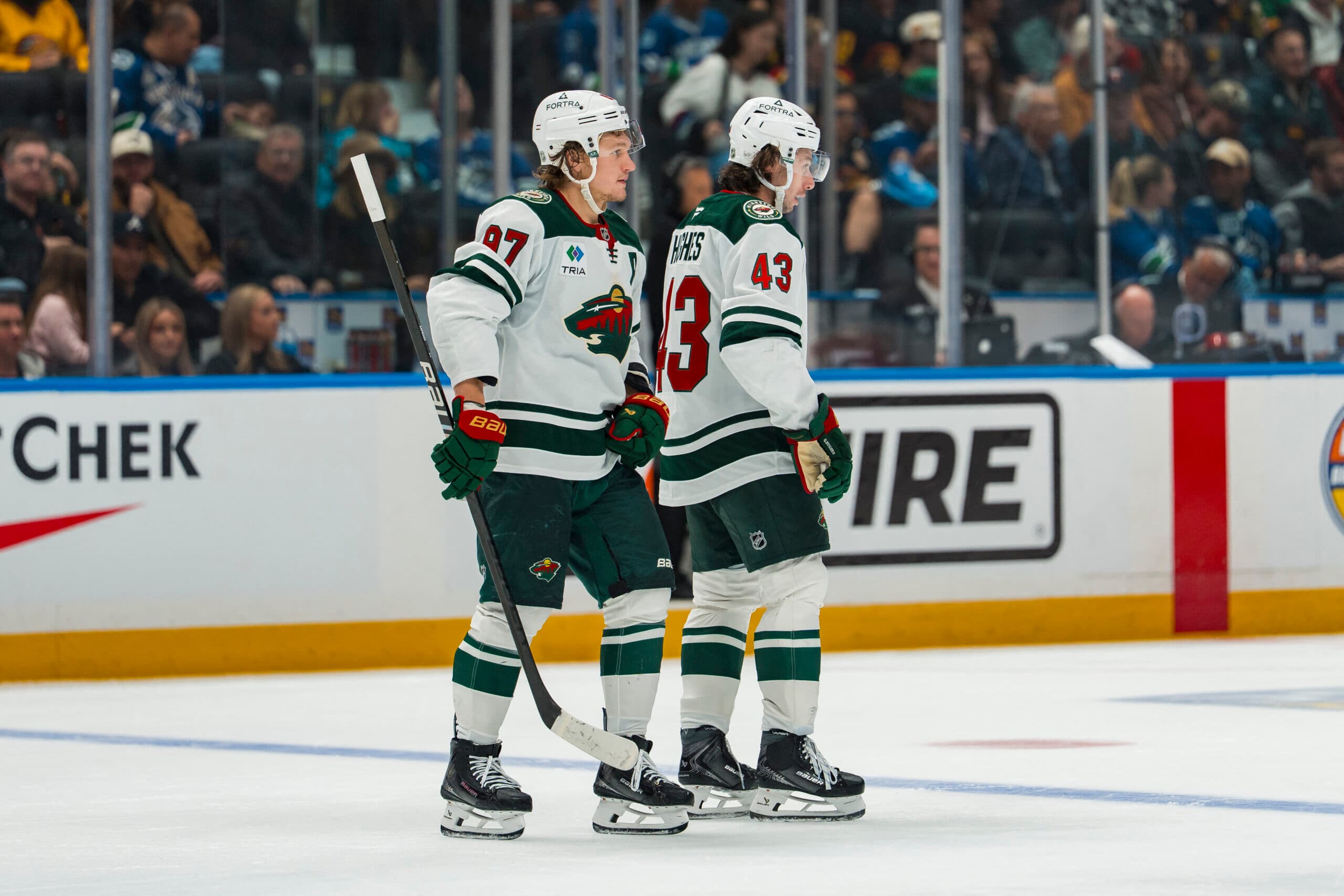 Minnesota Wild defenseman Quinn Hughes (43) celebrates his goal with forward Kirill Kaprizov (97) against the Vancouver Canucks in the second period at Rogers Arena.